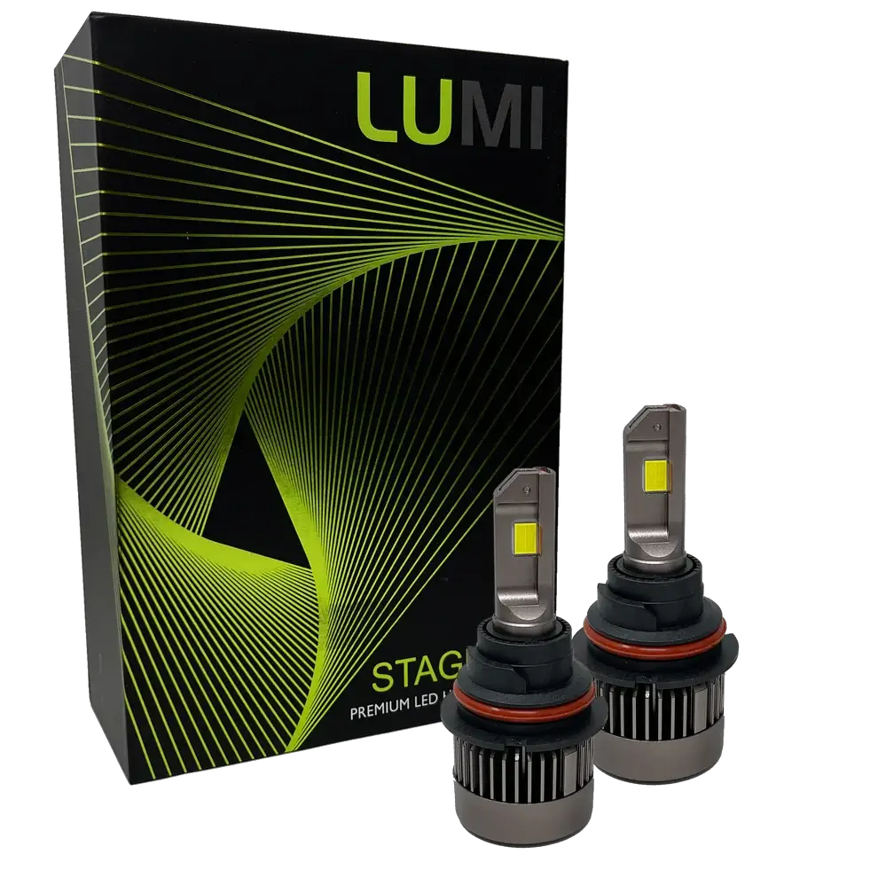 Two LUMI Stage 3 9007 LED Headlight Bulbs with advanced CSP chips and a bright 6000K color temperature are shown in front of a black Lumi box accented with green lines and the text “STAGE PREMIUM LED.”.