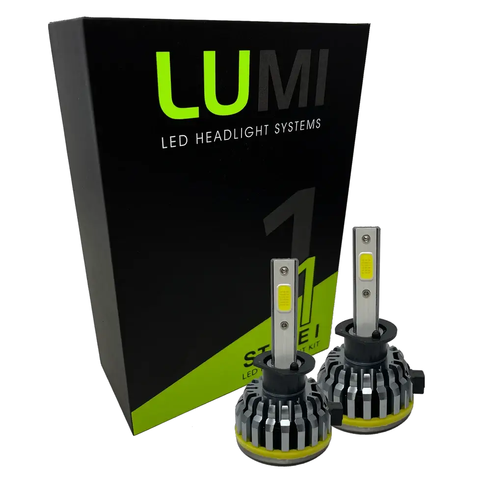 Two LUMI Stage 1 H1 LED Headlight Bulbs are displayed in front of a black and green Lumi box labeled “Stage 1 LED Headlight Kit,” featuring a powerful 40-watt output and a crisp 6000K color temperature for superior visibility.