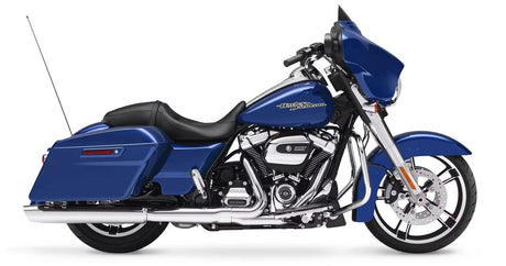 A blue Harley-Davidson touring motorcycle with black seat, chrome accents, saddlebags, and a front fairing, shown in profile on a white background.