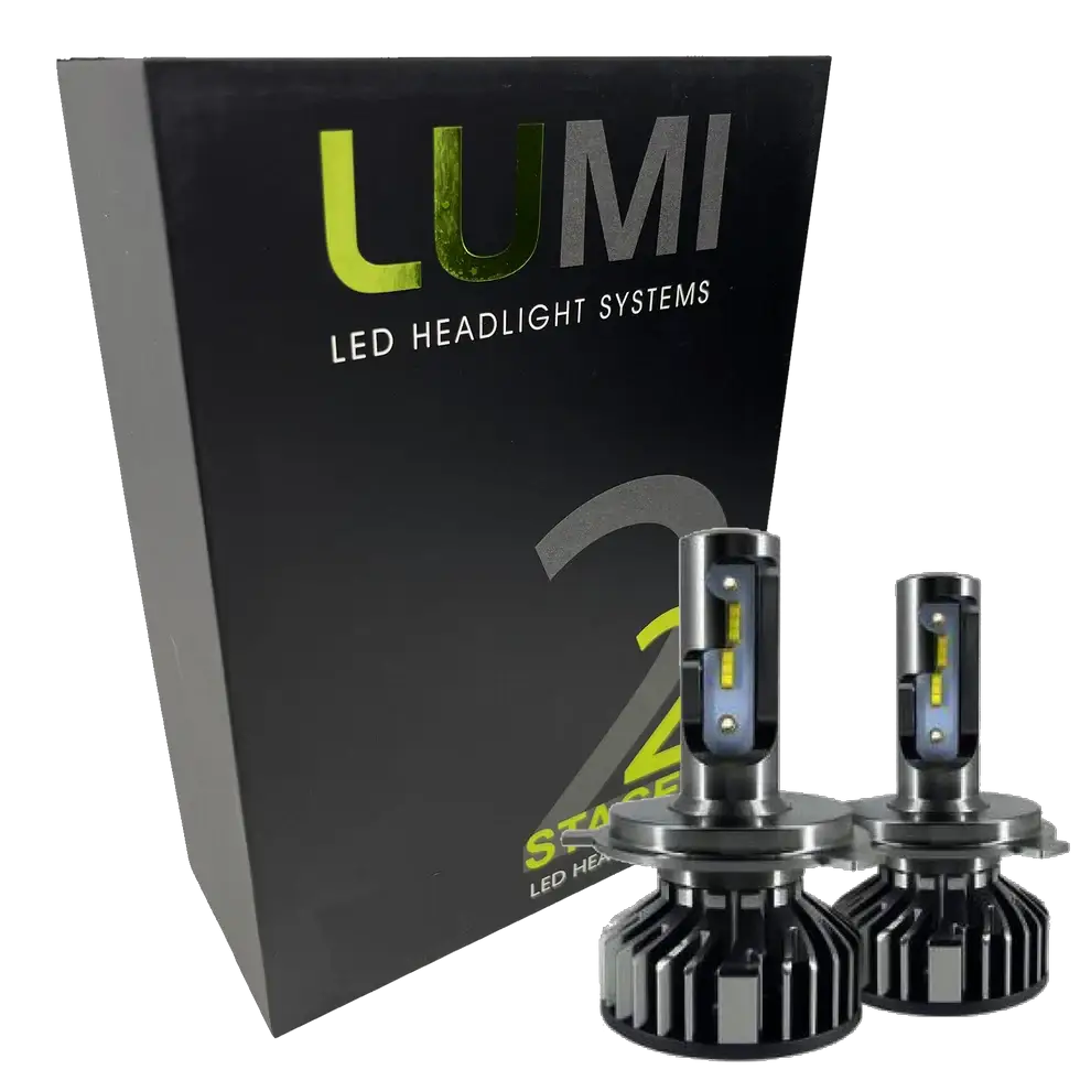 A black box labeled Lumi stands next to two LUMI Stage 2 880 LED headlight bulbs featuring metallic bases and yellow accents, all displayed against a white background.
