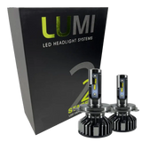 A black box labeled Lumi stands next to two LUMI Stage 2 880 LED headlight bulbs featuring metallic bases and yellow accents, all displayed against a white background.