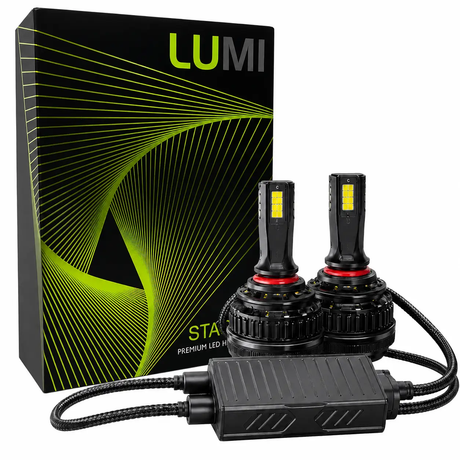 Two LUMI Stage 3 9005 LED headlight bulbs with attached cables are displayed next to a black and green Lumi-branded box featuring abstract lines. Featuring advanced CSP chips, these 6000K LED headlights provide bright and efficient illumination.
