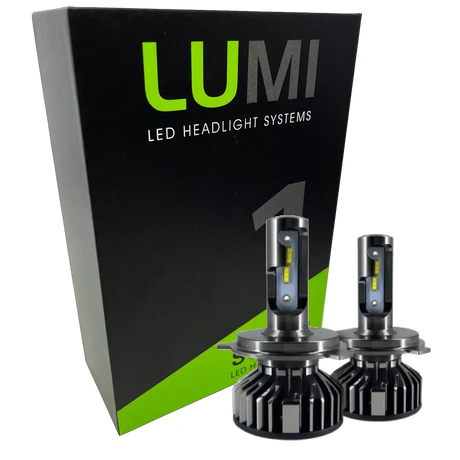 Two LUMI Stage 1 880 LED headlight bulbs from Lumi are displayed in front of a black and green box labeled “LUMI LED Headlight Systems.” With metallic bases and visible yellow LED strips, these 40 Watt, 6000K bulbs deliver brilliant illumination and are compatible with most vehicles due to their integrated LED CANBUS technology.