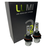 Two LUMI Stage 2 9004 LED Headlight Bulbs by Lumi are displayed in front of a black box labeled “LUMI LED Headlight Systems 2.” The bulbs have a metallic finish with prominent yellow CSP chips, delivering bright 6000K light for enhanced visibility.
