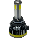 A close-up of a Lumi LUMI Stage 1 9006 LED Headlight Bulb with a silver heatsink, yellow sealing ring, and rectangular yellow LED chips engineered to deliver a crisp 6000K light output, isolated on a white background.