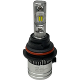 A silver LUMI Stage 2 9006 LED headlight bulb by Lumi, featuring visible yellow CSP chips, black and red rubber rings, and a cylindrical base labeled EMC 2022B, is displayed on a plain white background—ideal for those seeking modern LED headlights with a crisp 6000K output.