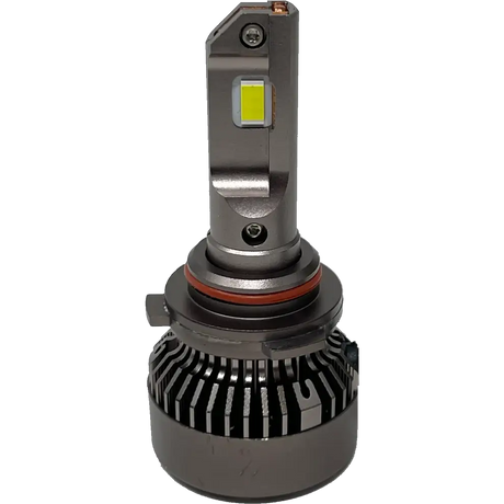 A close-up of a Lumi LUMI Stage 3 9006 LED headlight bulb featuring a 6000K color temperature, metallic base, integrated cooling fins, and a rectangular yellow CSP chip mounted on a silver vertical structure.