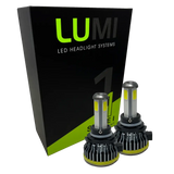 Two LUMI Stage 1 9006 LED Headlight Bulbs are displayed in front of a black and green Lumi box on a white background.