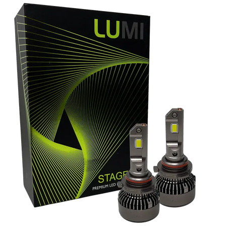 Two LUMI Stage 3 9006 LED headlight bulbs with heatsinks are displayed in front of a black Lumi box adorned with green and yellow curved line graphics, highlighting premium LED headlights that feature advanced CSP chips and a bright 6000K color temperature.