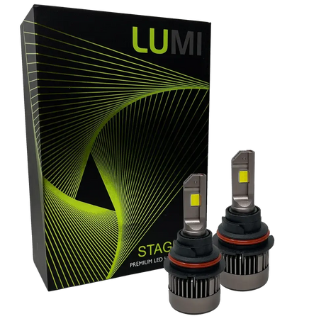 Two LUMI Stage 3 9007 LED Headlight Bulbs with advanced CSP chips and a bright 6000K color temperature are shown in front of a black Lumi box accented with green lines and the text “STAGE PREMIUM LED.”.