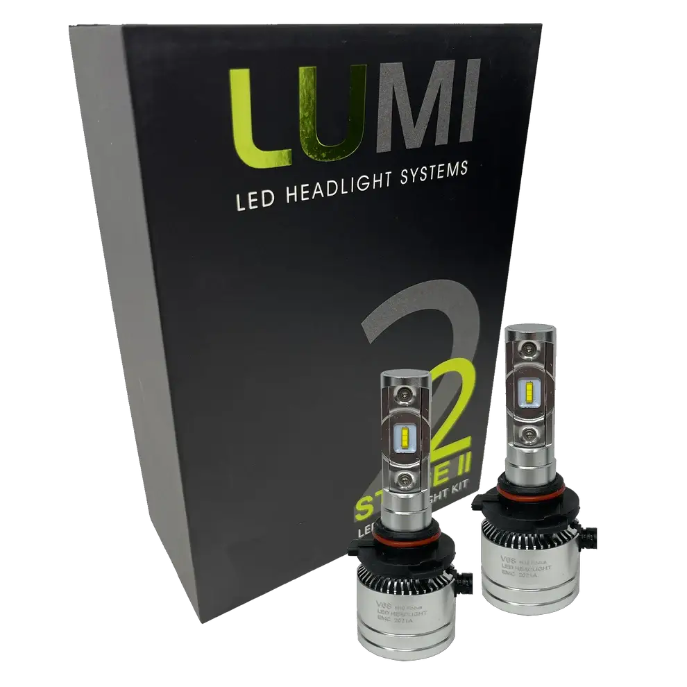 Two LUMI Stage 2 H10 LED Headlight Bulbs from Lumi, each delivering a bright 6000LM output with high-quality CSP chips, are displayed in front of a black Lumi LED Headlight Systems Stage 2 box against a white background.