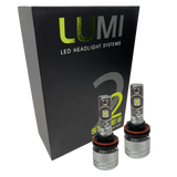 Two metallic Lumi Stage 2 H11 LED Headlight Bulbs, equipped with advanced CSP chips and delivering a crisp 6000K color temperature, are displayed in front of a black Lumi LED Headlight Systems box featuring “Stage II” and “2” branding.