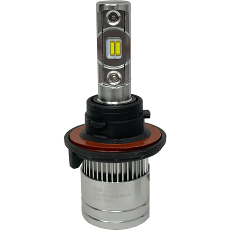 A close-up of a Lumi Stage 2 H13 LED headlight bulb highlights its silver base, black and orange ring, and two yellow CSP chips on the rectangular metal shaft, showcasing the advanced technology of modern 6000K bulbs from Lumi.