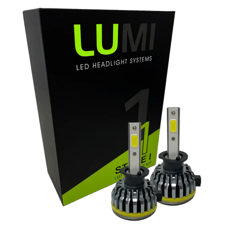 Two LUMI Stage 1 H1 LED Headlight Bulbs are displayed in front of a black and green Lumi box labeled “Stage 1 LED Headlight Kit,” featuring a powerful 40-watt output and a crisp 6000K color temperature for superior visibility.