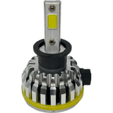 A close-up of a Lumi LUMI Stage 1 H3 LED Headlight Bulb (40 Watt, silver) featuring a black and yellow base, heat sink fins, and an LED CANBUS connector on the side, isolated on a white background.