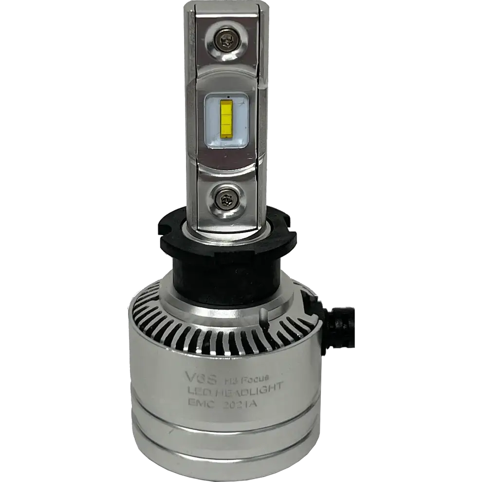 A LUMI Stage 2 H3 LED headlight bulb by Lumi, featuring a silver finish, 6000K color temperature, a cylindrical base with a black ring, and two yellow CSP chips mounted on a vertical metal strip, photographed against a plain white background.