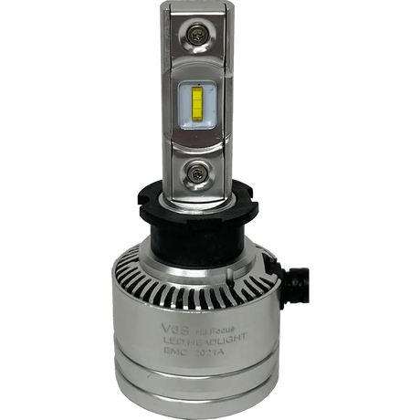 A LUMI Stage 2 H3 LED headlight bulb by Lumi, featuring a silver finish, 6000K color temperature, a cylindrical base with a black ring, and two yellow CSP chips mounted on a vertical metal strip, photographed against a plain white background.