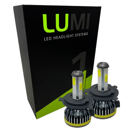 Two Lumi Stage 1 H4 LED Headlight Bulbs are displayed in front of a black and green LUMI LED Headlight Systems box on a plain white background, highlighting their 40-watt power, 6000K color temperature, and advanced LED CANBUS compatibility.