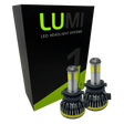 Two LUMI Stage 1 H7 LED headlight bulbs are displayed in front of a black and green Lumi box featuring bold branding. Equipped with advanced LED CANBUS technology, these 6000K, 40-watt bulbs provide bright, reliable illumination for enhanced nighttime visibility.
