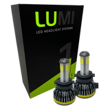 Two LUMI Stage 1 H7 LED headlight bulbs are displayed in front of a black and green Lumi box featuring bold branding. Equipped with advanced LED CANBUS technology, these 6000K, 40-watt bulbs provide bright, reliable illumination for enhanced nighttime visibility.