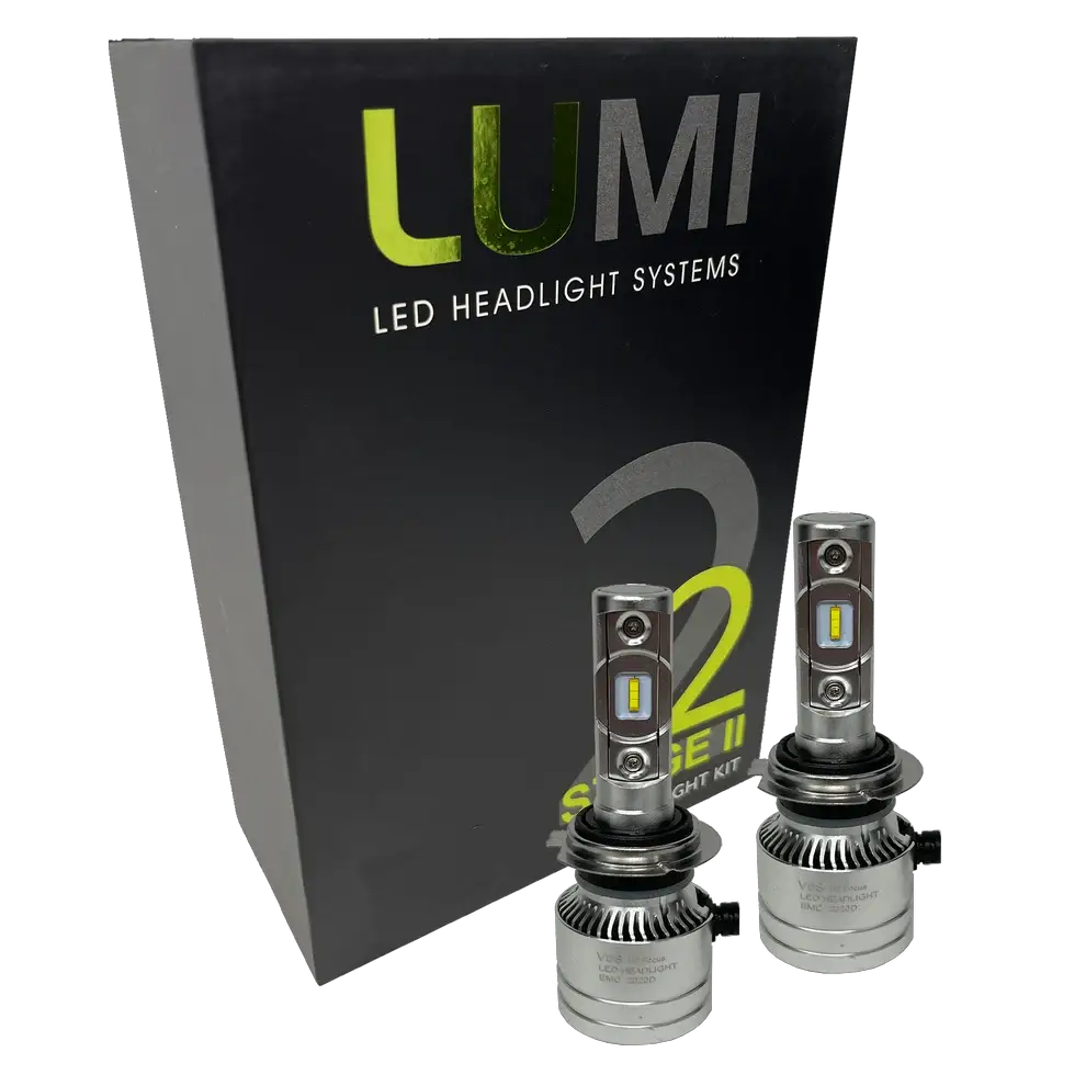 Two LUMI Stage 2 H7 LED Headlight Bulbs from Lumi, featuring advanced CSP chips, are displayed in front of a black box labeled “LUMI LED Headlight Systems S2 Stage II Headlight Kit” on a white background, providing bright 6000K illumination for superior visibility.