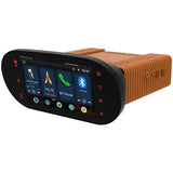 The Diamond Audio 1998-2013 Plug N-Play Digital Media Receiver for Harley Davidson® Road Glide (model MSHD9813RG) is a brown and black touchscreen car stereo system that features side control buttons, icons for radio, phone, and Bluetooth, and a digital clock displaying 16:01.