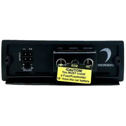 The back of the Diamond Audio 2-Channel MICRO8U Series Full Range Class D Amplifier (MICRO82U) displays output ports, power terminals, and a yellow caution label advising the installation of a fuse or fuse holder within 18 inches of the vehicle’s battery.