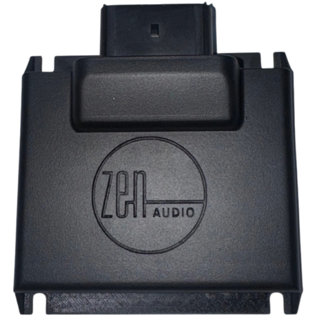 A black rectangular NAV-TV ZEN-H | Harley-Davidson A2B Audio Interface featuring a front-facing logo and a top connector port, engineered for seamless integration with Harley-Davidson amplifiers. Perfect for riders seeking a premium audio upgrade, this device is fully compatible with the ZEN-H processor, offering effortless enhancement of your Harley-Davidson sound system.